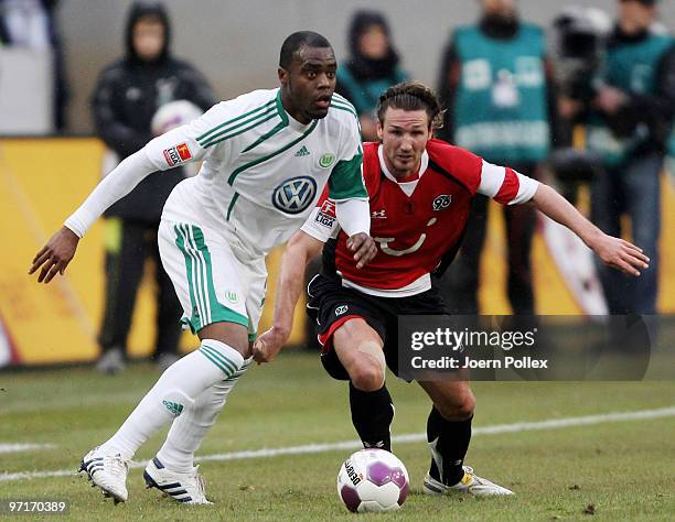 Christian Schulz of Hannover and Grafite of Wolfsburg battle for the ball during the Bundesliga match between Hannover 96 and VfL Wolfsburgat...