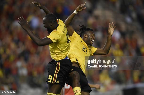 Belgium's forward Michy Batshuayi celebrates with Belgium's forward Romelu Lukaku after scoring a goal during the international friendly football...