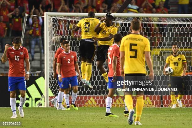 Belgium's forward Michy Batshuayi celebrates with Belgium's forward Romelu Lukaku after scoring a goal during the international friendly football...
