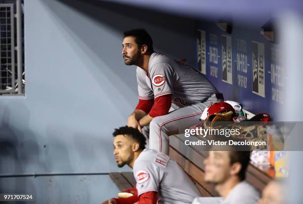 Pitcher Matt Harvey of the Cincinnati Reds looks on from the dugout after his at-bat in the second inning during the MLB game against the Los Angeles...
