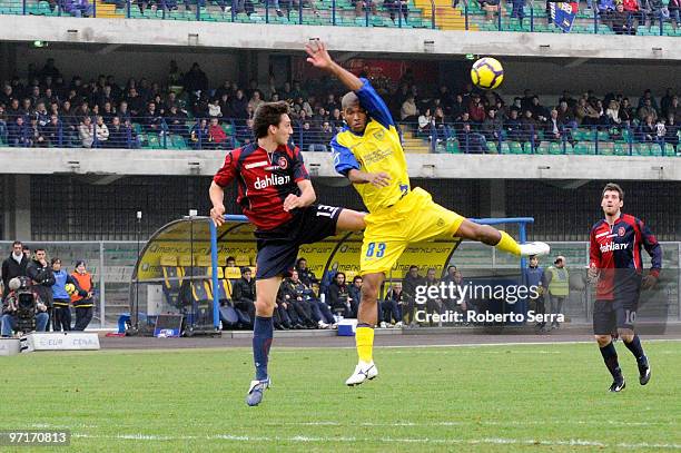 Marcos Ariel de Paula of Chievo competes with Davide Astori of Cagliari during the Serie A match between Chievo and Cagliari at Stadio Marc'Antonio...