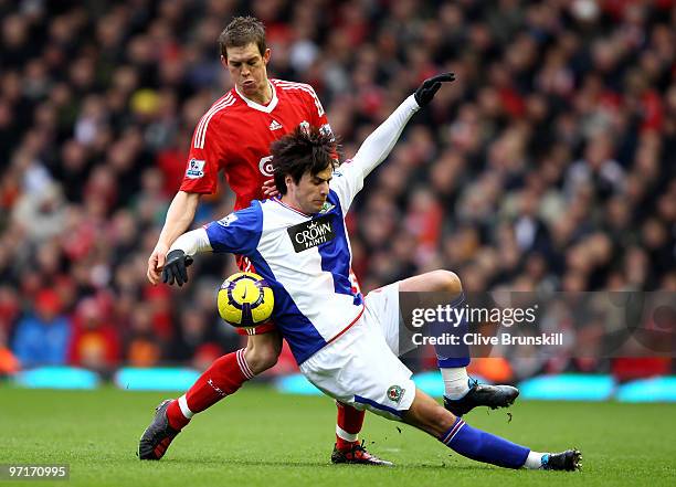 Daniel Agger of Liverpool challenges Nikola Kalinic of Blackburn Rovers during the Barclays Premier League match between Liverpool and Blackburn...