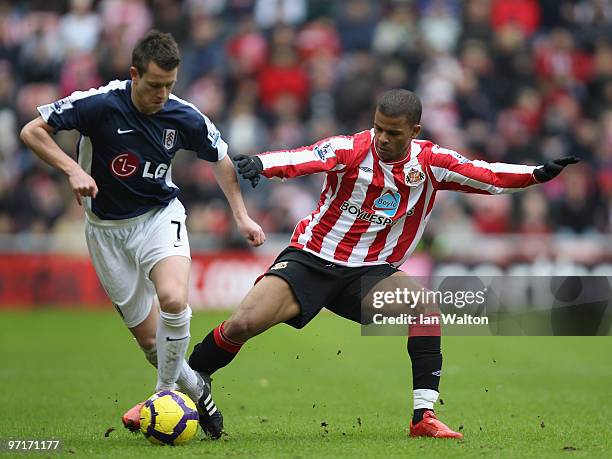 Fraizer Campball of Sunderland and Nicky Shorey of Fulham in action during the Barclays Premier League match between Sunderland and Fulham at Stadium...