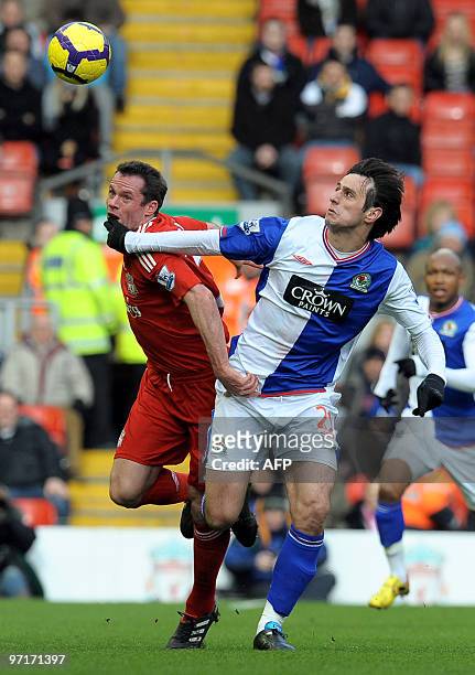 Liverpool's English defender Jamie Carragher fights for the ball with Blackburn Rovers' Croatian forward Nikola Kalinic during their English Premier...