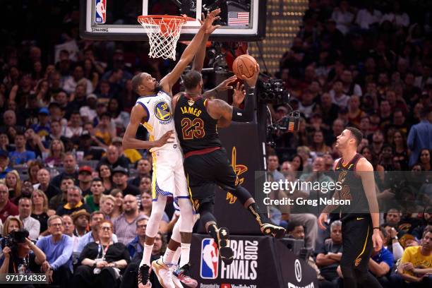 Finals: Rear view of Cleveland Cavaliers LeBron James in action vs Golden State Warriors Kevin Durant at Quicken Loans Arena. Game 4. Cleveland, OH...