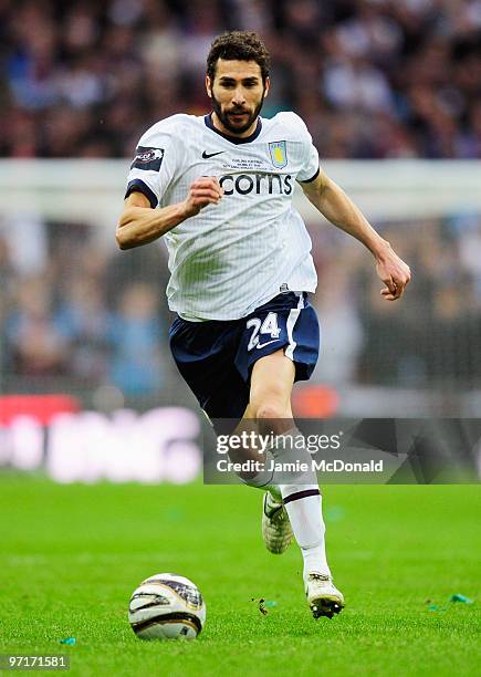 Carlos Cuellar of Aston Villa runs with the ball during the Carling Cup Final between Aston Villa and Manchester United at Wembley Stadium on...