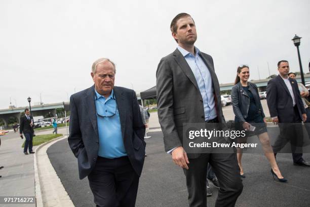 Golfing legend Jack Nicklaus walks with Eric Trump as they arrive for a ribbon cutting event for a new clubhouse at Trump Golf Links at Ferry Point,...