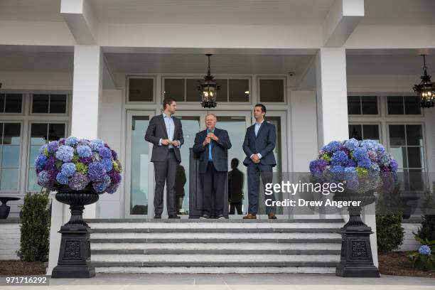 Flanked by Eric Trump and Donald Trump Jr. , golfing legend Jack Nicklaus speaks during a ribbon cutting event for a new clubhouse at Trump Golf...