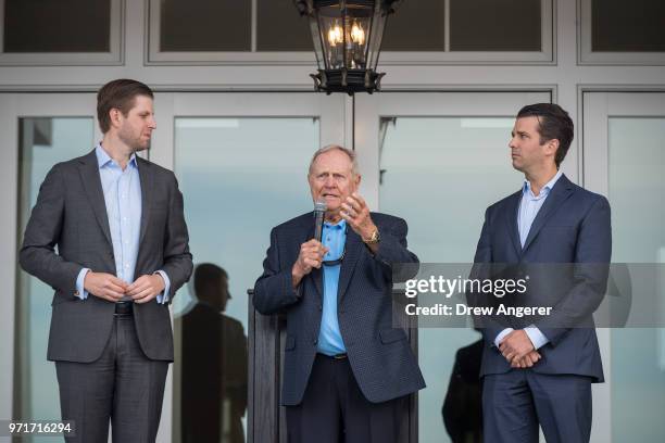 Flanked by Eric Trump and Donald Trump Jr. , golfing legend Jack Nicklaus speaks during a ribbon cutting event for a new clubhouse at Trump Golf...