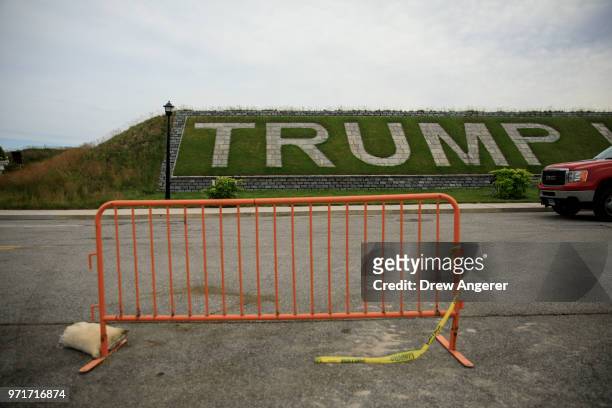 Brand signage is displayed prior to the start of a ribbon cutting event for a new clubhouse at Trump Golf Links at Ferry Point, June 11, 2018 in The...