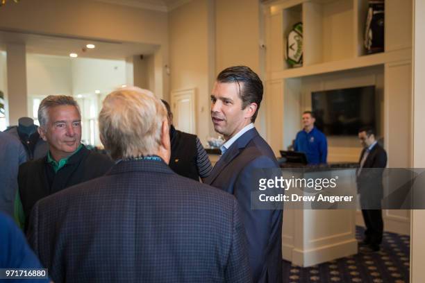 Donald Trump Jr. Mingles with guests following a ribbon cutting event for a new clubhouse at Trump Golf Links at Ferry Point, June 11, 2018 in The...