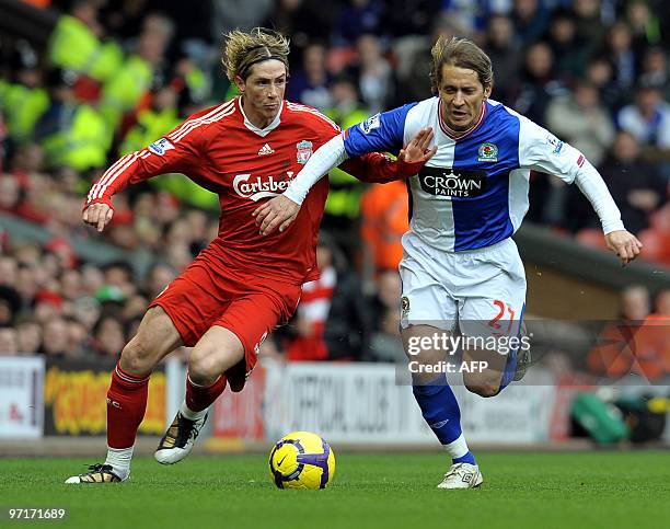 Blackburn Rovers' Spanish defender Míchel Salgado fights for the ball with Liverpool's Spanish forward Fernando Torres during their English Premier...
