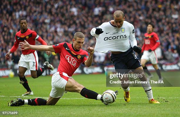 Gabriel Agbonlahor of Aston Villa is fouled by Nemanja Vidic of Manchester United to give away a penalty during the Carling Cup Final between Aston...