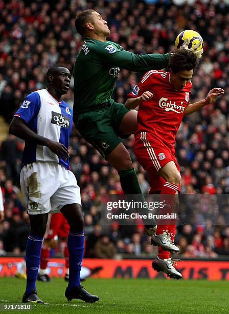 Paul Robinson of Blackburn Rovers claims the ball under pressure from Yossi Benayoun of Liverpool during the Barclays Premier League match between...