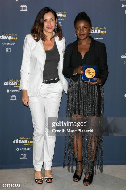 Actress Aure Atika and Khadidiatou Sow attend the 'Les Nuits En Or 2018' dinner gala at UNESCO on June 11, 2018 in Paris, France.