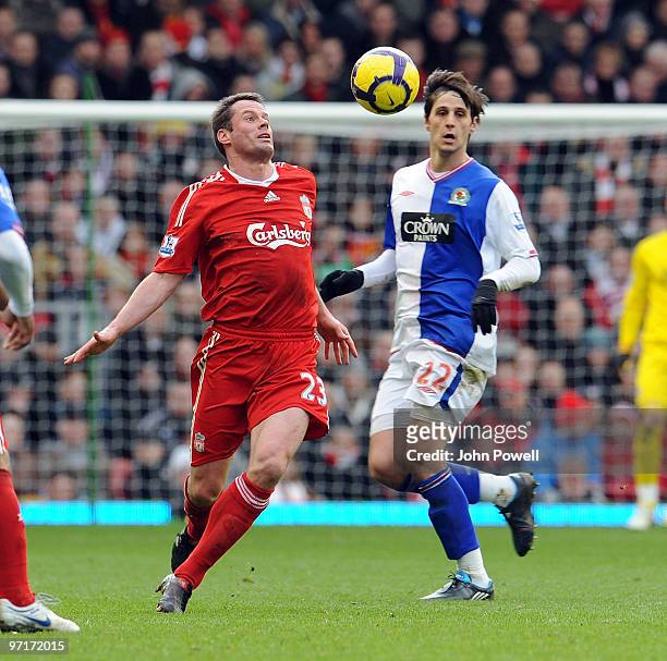 Jamie Carragher of Liverpool competes with Nikola Kalinic of Blackburn Rovers during a Barclays Premier League game between Liverpool and Blackburn...