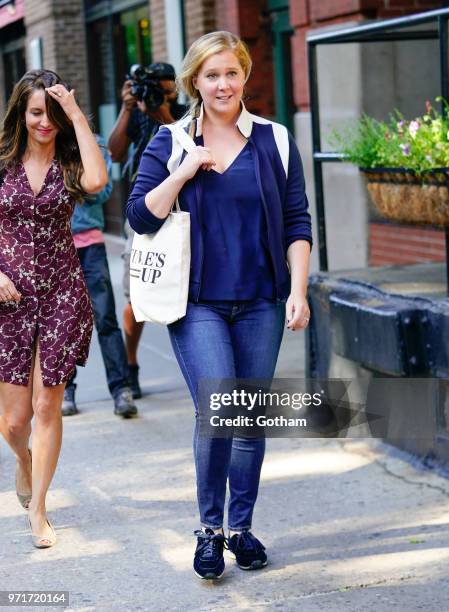 Amy Schumer does some funny moves on June 11, 2018 in New York City.