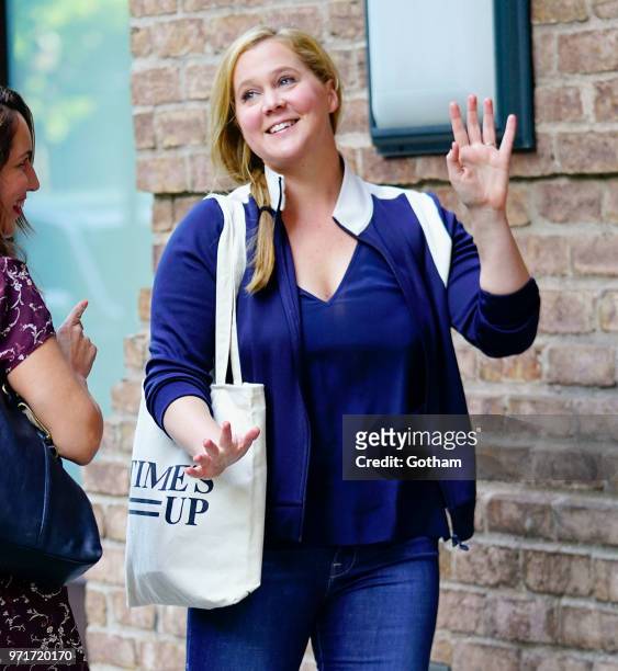 Amy Schumer does some funny moves on June 11, 2018 in New York City.