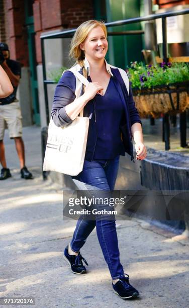 Amy Schumer does some funny moves on June 11, 2018 in New York City.