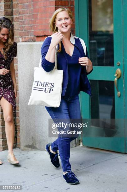 Amy Schumer does some funny moves on June 11, 2018 in New York City.