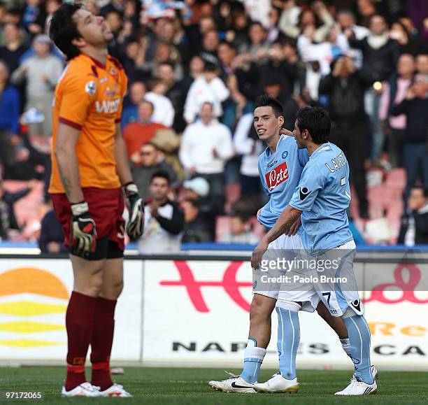 Marek Hamsik and his teammate Ivan Ezequiel Lavezzi of SSC Napoli celebrate the second goal as Alexander Doni the goalkeeper of AS Roma shows his...