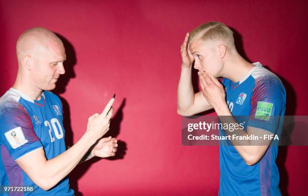 Emil Hallfredsson and Hordur Magnusson of Iceland pose for a picture during the official FIFA World Cup 2018 portrait session at on June 11, 2018 in...