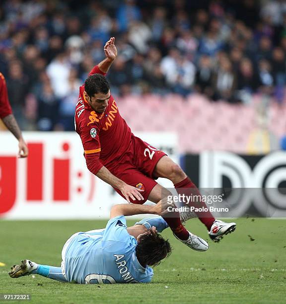 Simone Perrotta of AS Roma and Salvatore Aronica of SSC Napoli in action during the Serie A match between Napoli and Roma at Stadio San Paolo on...