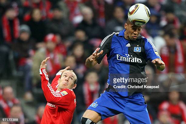 Arjen Robben of Bayern and Jérome Boateng of Hamburg jump for a header during the Bundesliga match between FC Bayern Muenchen and Hamburger SV at...