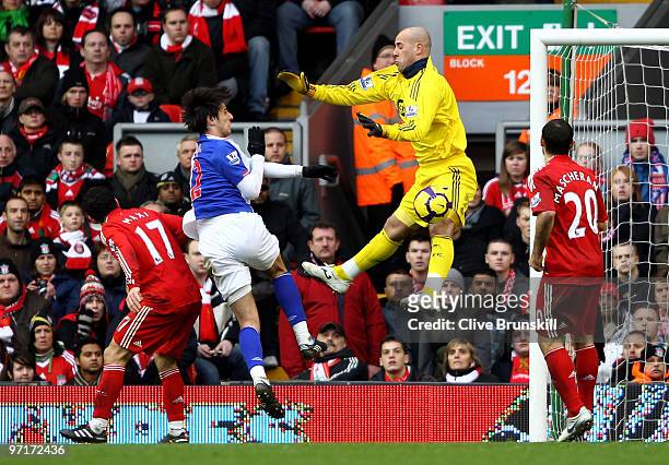 Pepe Reina of Liverpool blocks the shot of Nikola Kalinic of Blackburn Rovers during the Barclays Premier League match between Liverpool and...
