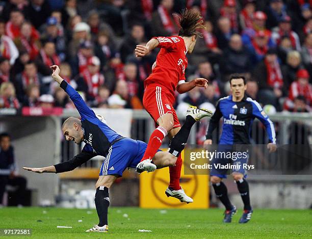 Martin Demichelis of Bayern and Mladen Petric of Hamburg battle for the ball during the Bundesliga match between FC Bayern Muenchen and Hamburger SV...