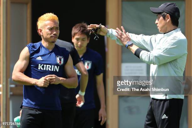 Head coach Akira Nishino of Japan talks to Yuto Nagatomo during a training session on June 10, 2018 in Seefeld, Austria.