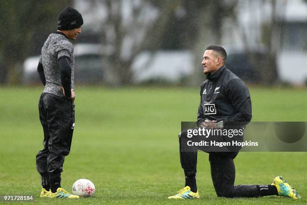 Aaron Smith talks to Sonny Bill Williams during a New Zealand All Blacks training session at Hutt Recreation Ground on June 12, 2018 in Wellington,...