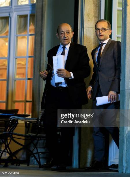 French Foreign Minister Jean-Yves Le Drian and German Foreign Minister Heiko Maas arrive for a joint press conference following a Normandy format...