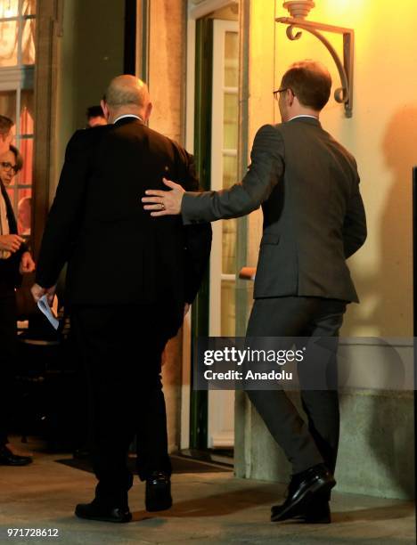 German Foreign Minister Heiko Maas and French Foreign Minister Jean-Yves Le Drian leave after a joint press conference following their Normandy...