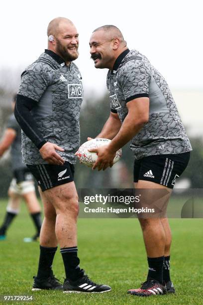 Karl Tu'inukuafe enjoys a laugh with Owen Franks during a New Zealand All Blacks training session at Hutt Recreation Ground on June 12, 2018 in...