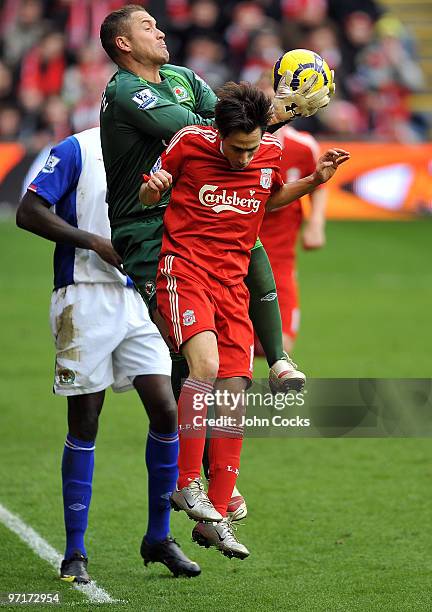 Yossi Benayoun of Liverpool goes up with Paul Robinson of Blackburn Rovers during a Barclays Premier League game between Liverpool and Blackburn...