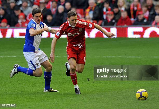Fabio Aurelio of Liverpool competes with Keith Andrews of Blackburn Rovers during a Barclays Premier League game between Liverpool and Blackburn...