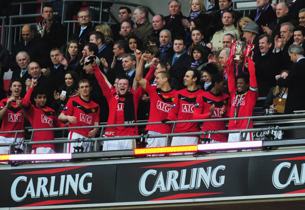 Captain Patrice Evra of Manchester United lifts the trophy after victory during the Carling Cup Final between Aston Villa and Manchester United at...