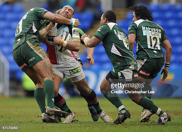 Jordan Turner-Hall of Quins is tackled by Chris Hala'ufia of Irish during the Guinness Premiership match between London Irish and Harlequins at the...