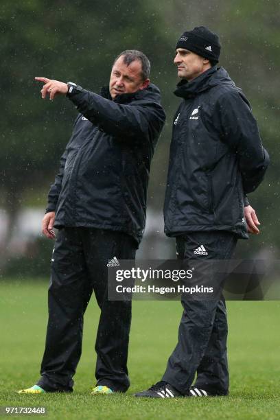 Assistant coaches Ian Foster and Scott McLeod talk during a New Zealand All Blacks training session at Hutt Recreation Ground on June 12, 2018 in...