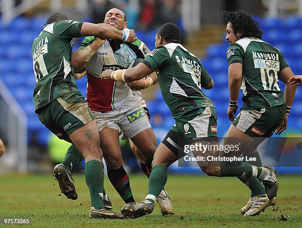 Jordan Turner-Hall of Quins is tackled by Chris Hala'ufia of Irish during the Guinness Premiership match between London Irish and Harlequins at the...