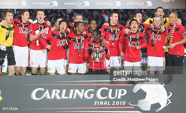 The Manchester United squad celebrate after the Carling Cup Final match between Aston Villa and Manchester United at Wembley Stadium on February 28...