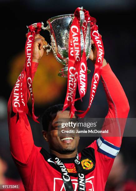 Captain Patrice Evra of Manchester United celebrates with the trophy after victory in the Carling Cup Final between Aston Villa and Manchester United...