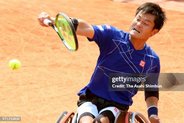 Shingo Kunieda of Japan plays a backhand during the mens singles wheelchair final agains Gustavo Fernandez of Argentina during day fourteen of the...