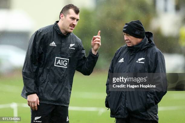 Brodie Retallick speaks to coach Steve Hansen during a New Zealand All Blacks training session at Hutt Recreation Ground on June 12, 2018 in...
