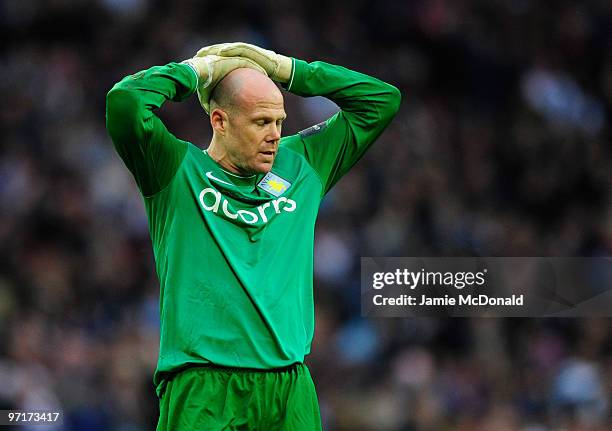 Brad Friedel of Aston Villa looks dejected during the Carling Cup Final between Aston Villa and Manchester United at Wembley Stadium on February 28,...