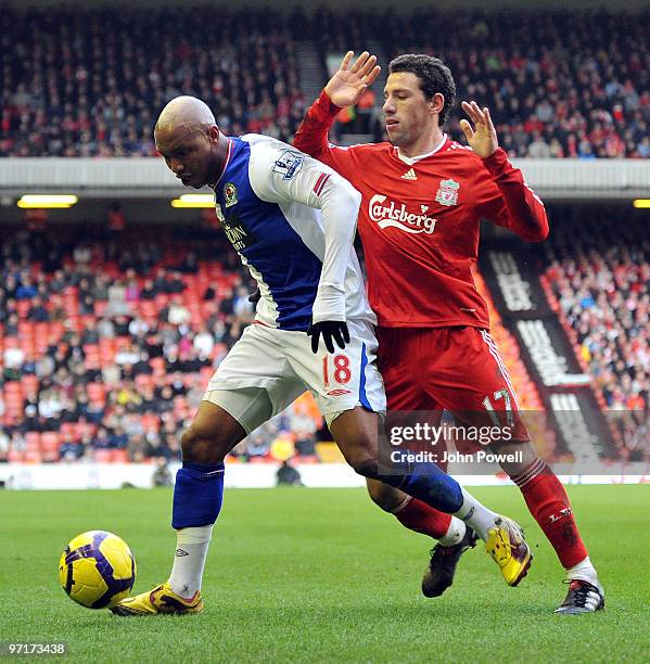 Maxi Rodriguez of Liverpool competes with El Hadji Diouf of Blackburn Rovers during a Barclays Premier League game between Liverpool and Blackburn...