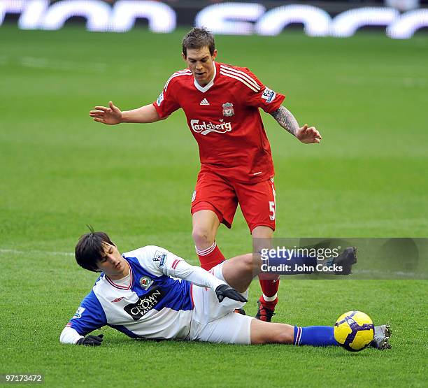 Daniel Agger of Liverpool competes with Nikola Kalinic of Blackburn Rovers during a Barclays Premier League game between Liverpool and Blackburn...