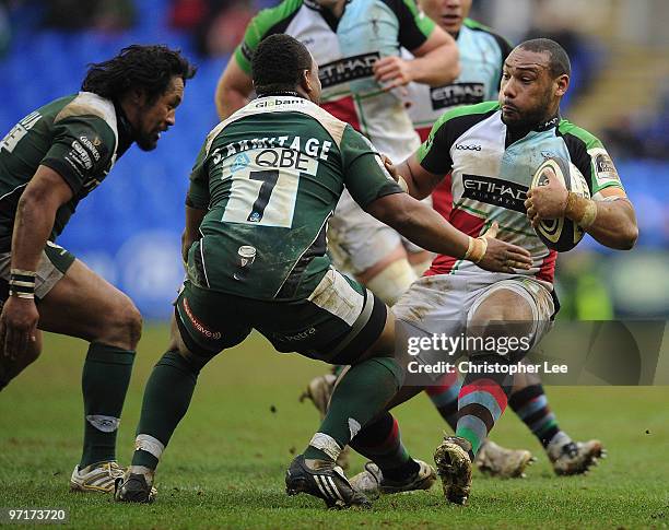 Jordan Turner-Hall of Quins backs away from Seilala Mapusua and Steffon Armitage of Irish during the Guinness Premiership match between London Irish...