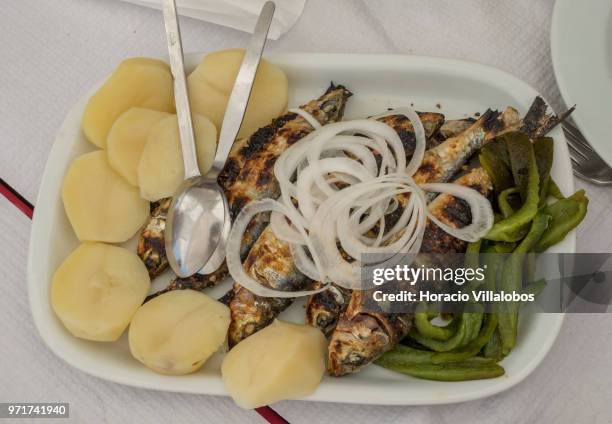 Dish of grilled sardines with potatoes, onions and green peppers served at "Restaurante Alfandega" by Ave River on May 28, 2018 in Vila do Conde,...